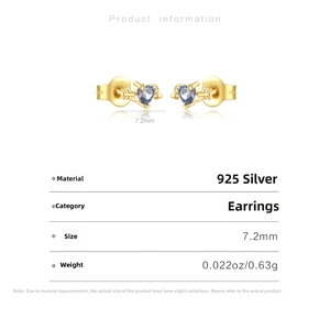 Detail view showing 925 sterling silver heart arrow earrings with blue cubic zirconia