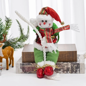 Festive Christmas snowman doll on rope with red and green outfit for holiday home decor