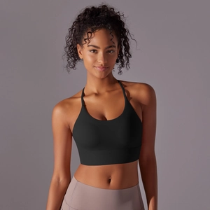 Macro detail of black nylon sports bra fabric showing sweat-wicking texture and stitching