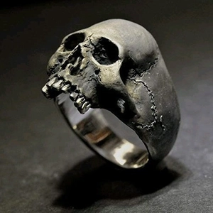 Gothic skull ring for men with vintage silver finish and detailed bone texture carvings