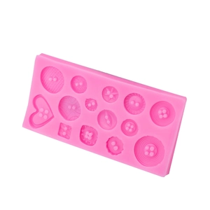 Pink silicone button mold for fondant and resin cake decorating on white background