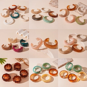 Collection of retro acrylic geometric bangles in tortoiseshell and amber resin finishes