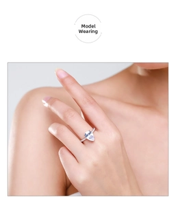 Close-up of luxury 925 silver pear-shaped 3ct diamond ring on model finger