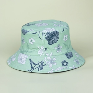 Mint green sun bucket hat with hand-drawn white floral patterns for summer sun protection