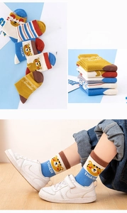 Detail of cotton tiger socks with cartoon prints and ROAR text for boys and girls