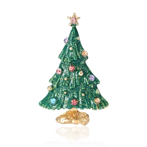 Enamel Christmas tree brooch with colorful rhinestones and gold star on white background