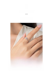 Close-up of elegant S925 silver ring with a round zircon on a model hand