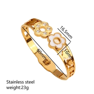 Golden stainless steel heart flower spring open bangle with white petals and rhinestones