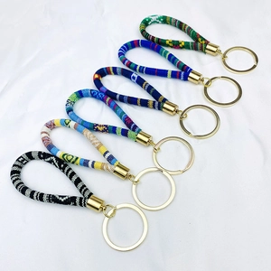 Bohemian woven fabric wristlet keychains in assorted patterns with gold metal clasps