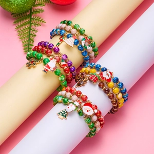 Three-piece Christmas beaded bracelet set featuring Santa Claus and Christmas tree charms