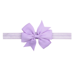 Detail of lavender grosgrain ribbon bow on ultra-soft elastic headband for infants