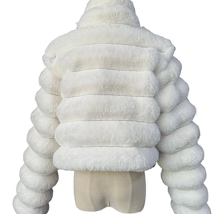 Detail of white faux fur coat showing fluffy horizontal striped texture and plush material