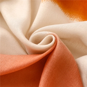 Elegant orange and beige gradient scarf in soft woven fabric for autumn styling
