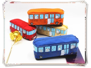 Detailed top view of four colorful bus-shaped canvas pencil cases with cartoon cat prints