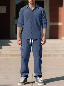 Detail of dark blue corduroy fabric on a men's casual long sleeve shirt and cargo pants