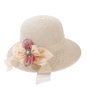 Foldable beige straw sun hat for women featuring a pink chiffon bow with pearl accents