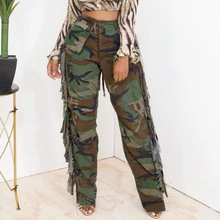 Detail of high-waisted camo pants showing multi-layered side fringe and woven fabric texture