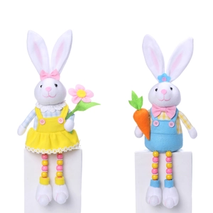 Close-up of Easter plush bunnies with beaded legs holding a flower and a carrot