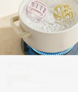 Close-up of food-grade silicone teether ball being boiled for high temperature sterilization