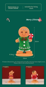 Detail of hand-painted resin gingerbread girl figurines for Christmas decor