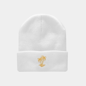 Detailed close-up of white knitted beanie featuring yellow palm tree embroidery on cuff