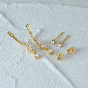 Macro view of S925 sterling silver gold earrings with clear zircon stones and S925 hallmark