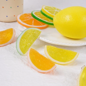 Realistic PVC lemon and orange slices for home decor and photography props on white cloth