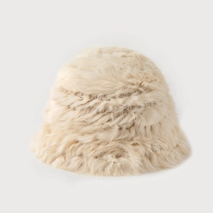 Close-up of soft beige faux rabbit fur bucket hat showing warm plush texture details