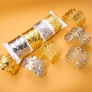 Elegant gold and silver stainless steel bangles set with floral and leaf patterns