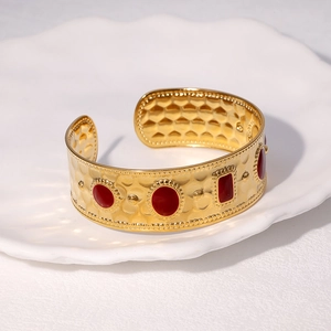 18K gold plated stainless steel cuff bracelet with vintage hammered texture and red enamel