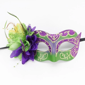 Exquisite carnival feather mask with gold glitter floral patterns in green and purple