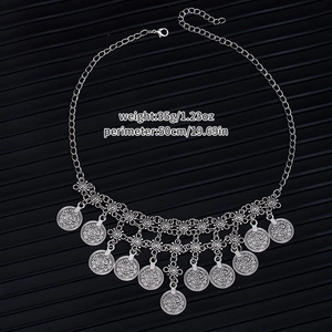 Detail showing vintage bohemian waist chain with coin tassels and size specifications