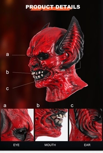 Detail view of the red demon mask showing eyes, mouth, and ear texture for Halloween