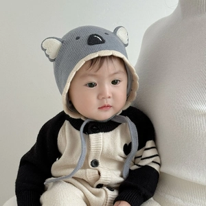 Close-up of baby winter hat featuring 3D koala ears and detailed animal embroidery