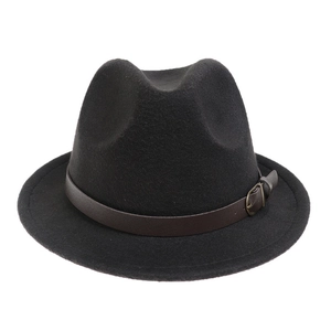 Macro detail of black fedora hat with dark brown leather belt and metal buckle
