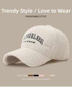 Detail view of beige sherpa baseball cap with Angeless Ace Made black embroidery