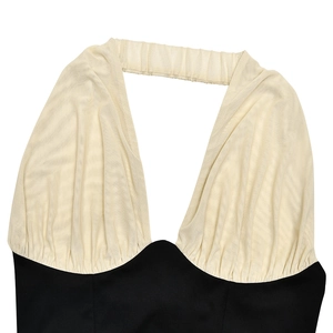 Detail of a color-block halter top with beige mesh ruching and a deep V-neckline
