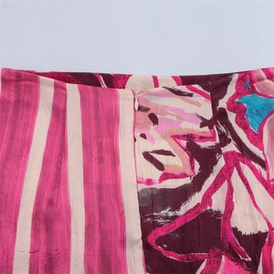 Women's silk satin midi skirt with vibrant print and invisible waist zipper detail