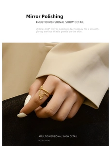 Detailed view of gold double-layer chain ring on finger with 18K mirror polish finish