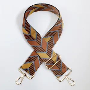 Adjustable woven replacement bag strap with golden hardware and retro arrow pattern
