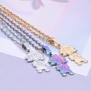 Detailed view of boy and girl pendant necklaces in gold, silver and iridescent finish