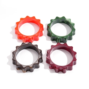 Exaggerated geometric flower bangles in acrylic resin with colorful marble patterns