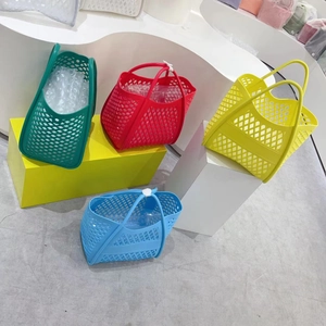Colorful hollow jelly tote bags in green, red, yellow and blue for beach or picnic storage