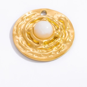 Macro detail of 18k gold plated round pendant with central pearl and wavy metal texture