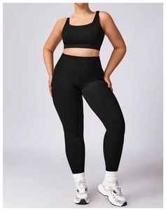 Front view of black high-waisted yoga leggings and sports bra set for fitness
