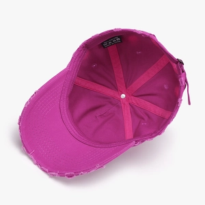 Deep rose red washed cotton baseball cap with distressed details and adjustable strap
