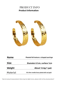 Detail of C-shaped hoop earrings with gold foil texture, 4.1cm diameter and 925 silver needle