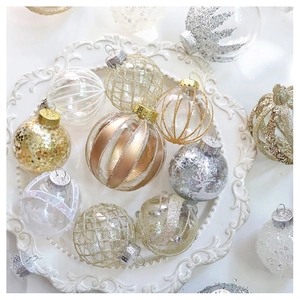 Detail of assorted champagne Christmas ornaments with sequins, glitter and elk patterns