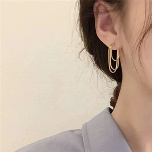 Elegant gold minimalist triple-hoop earrings featuring a geometric layered design for women