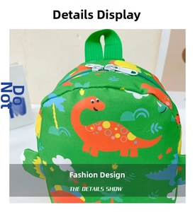 Detailed macro view of the double zipper closure and cute dinosaur print on kids backpack